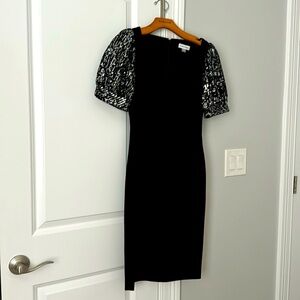 Beautiful worn once black midi Calvin Klein dress with sequence puffed sleeves.
